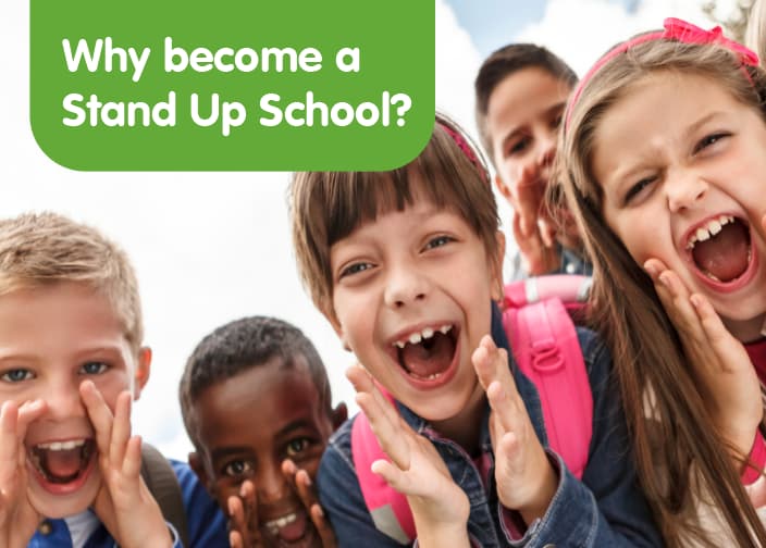 Group of young children huddled together facing the camera and shouting with enthusiasm.